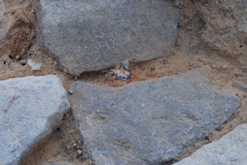  Roman camp gateway paving stones with a shoe nail between the stones